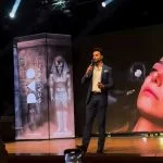 Dr Zack Ally on stage speaking