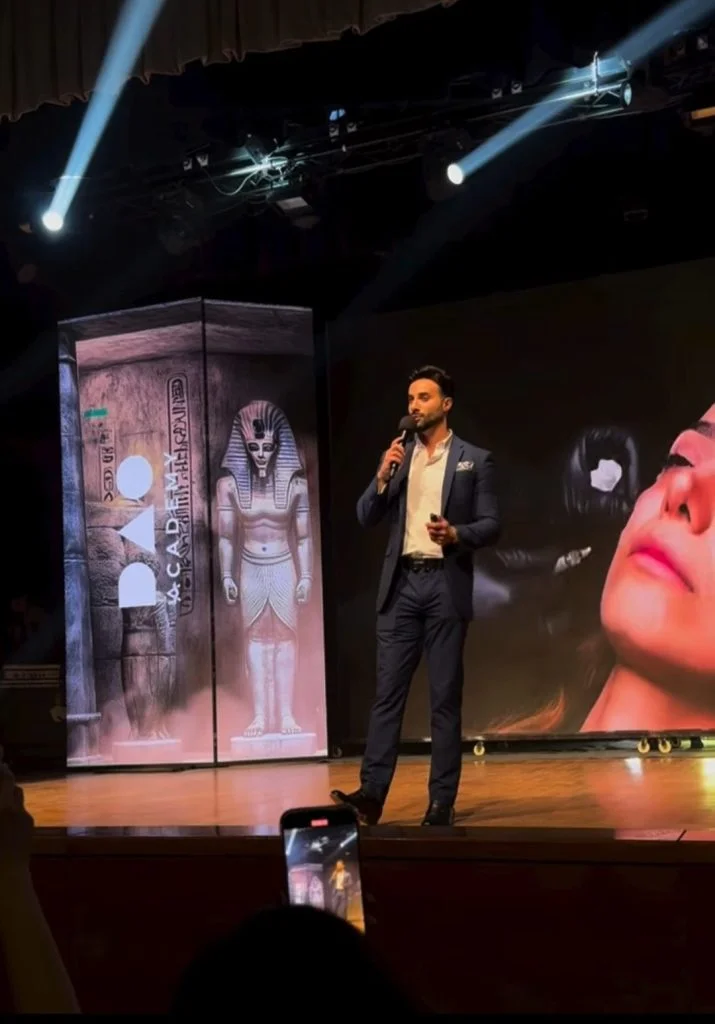 Dr Zack Ally on stage speaking